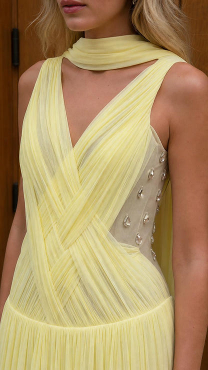 Close-up of yellow dress bodice with ruching and crystal side panel